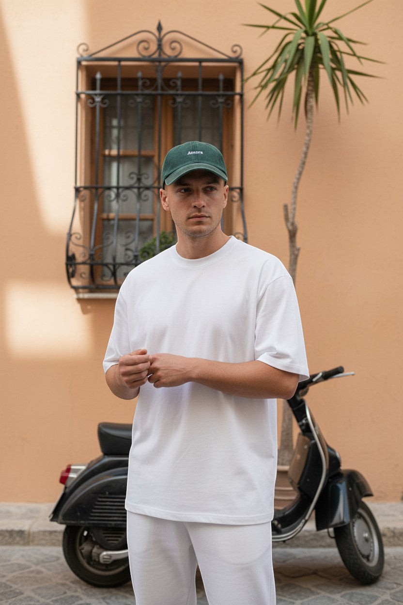 Il mio negozio Amore hat in vintage washed dark green cotton with embroidered text and adjustable buckle.