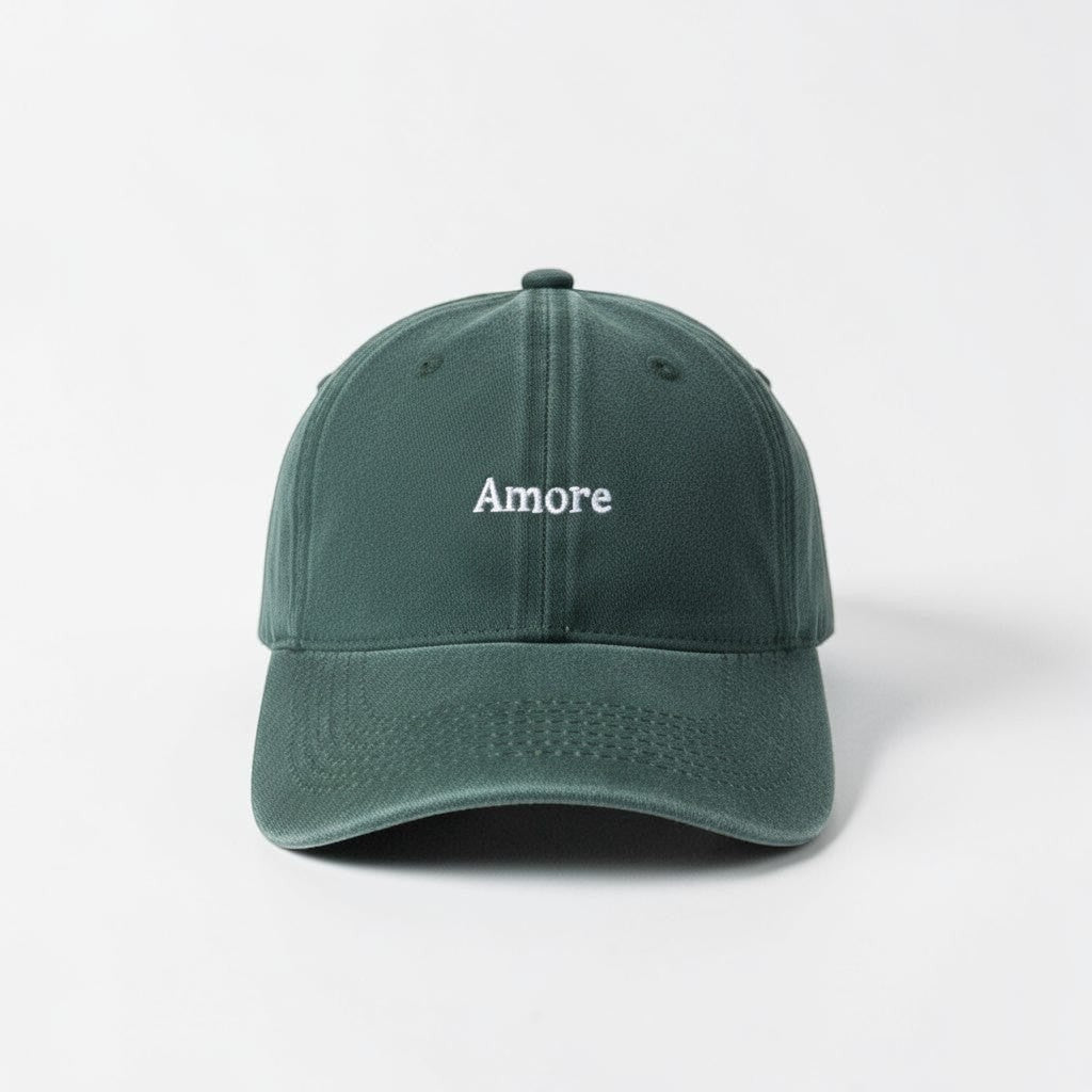 Il mio negozio Amore hat in vintage washed green cotton with embroidered text and adjustable buckle.