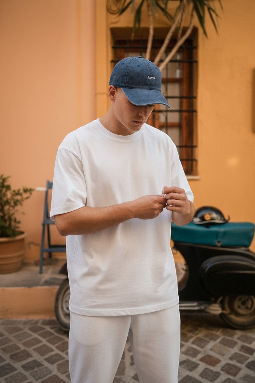 Il mio negozio navy blue cotton baseball cap with embroidered 'Aperò' text. Casual, stylish, and perfect for travel.