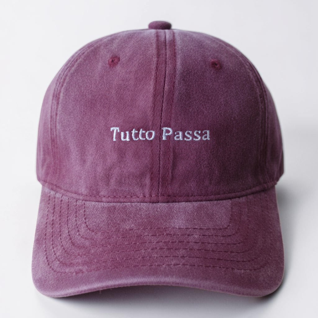 Il mio negozio vintage-washed dad hat in burgundy cotton with "Tutto Passa" embroidery and adjustable buckle.